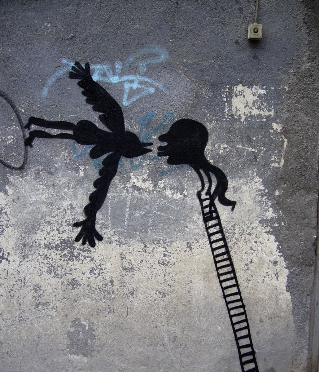 Black silhouette of a winged bird-woman figure with dangling human legs facing a profile head atop a tall ladder, mouths almost touching, blue graffiti scribbles above, a doorbell mounted on the wall.