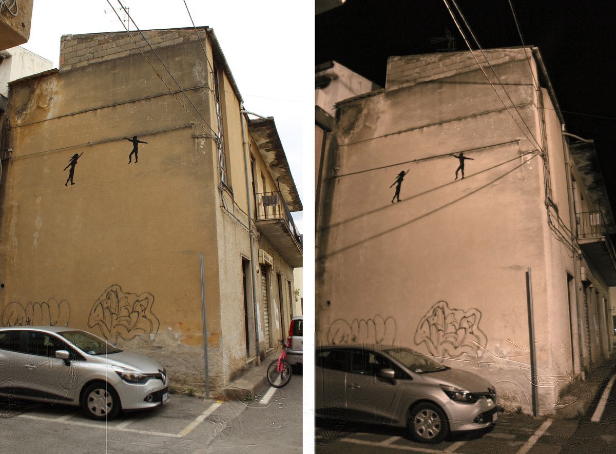 Two-photo day and night comparison of a building corner mural showing two black silhouette tightrope walkers balanced on overhead wires, parked cars below in both shots.