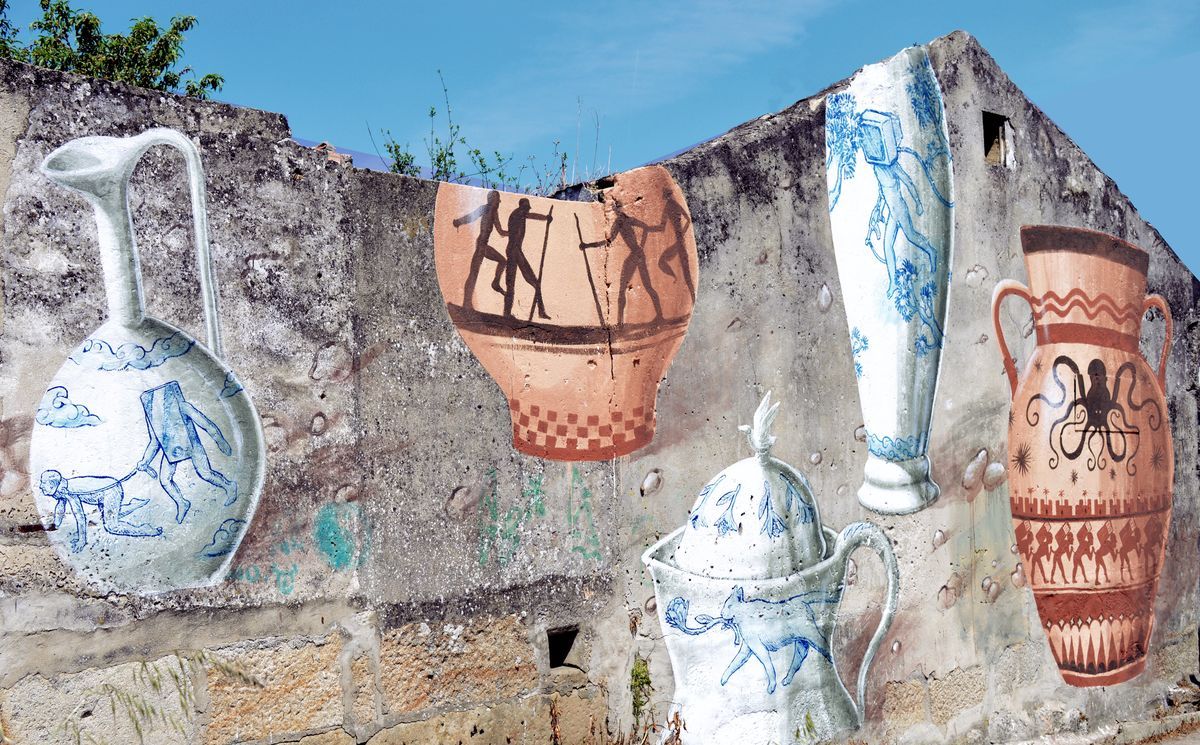 Mural on a ruined stone wall depicting several oversized ceramic vessels painted in traditional blue-and-white and terracotta patterns, including jugs, an amphora with a frieze of marching figures, and an amphora decorated with an octopus.