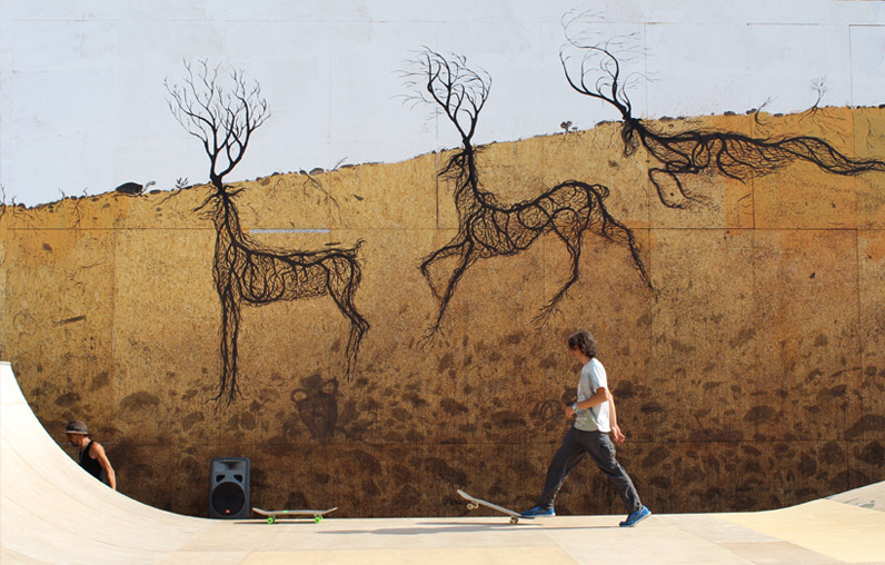 Two black wireframe deer made of root lines on a curved skate park wall, with a skateboarder and another person standing near ramps and a speaker below.