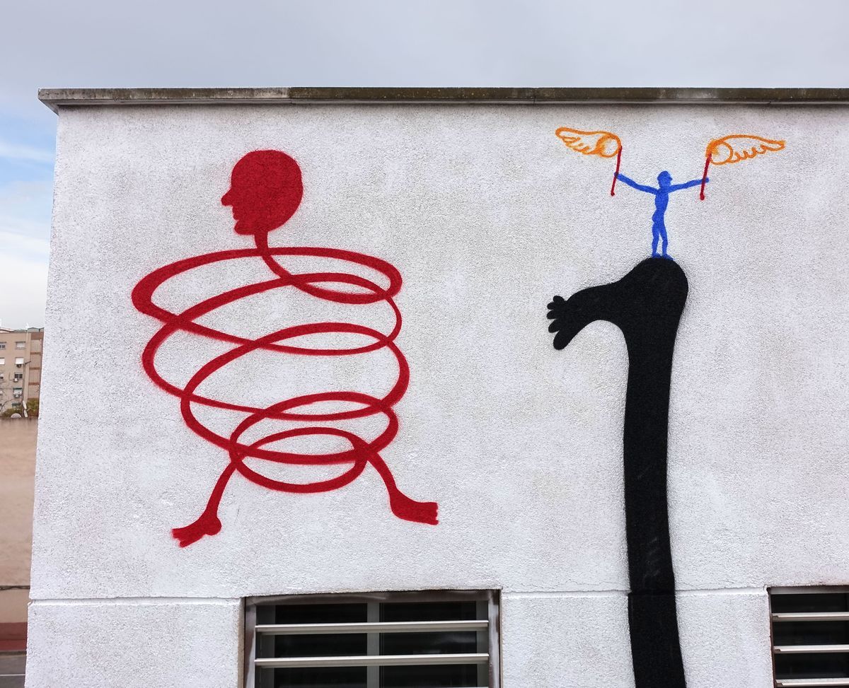 Painted detail of a coiled red figure made of loops with a round head, beside a black arm reaching up to a blue winged figure holding two torches standing on its shoulder.