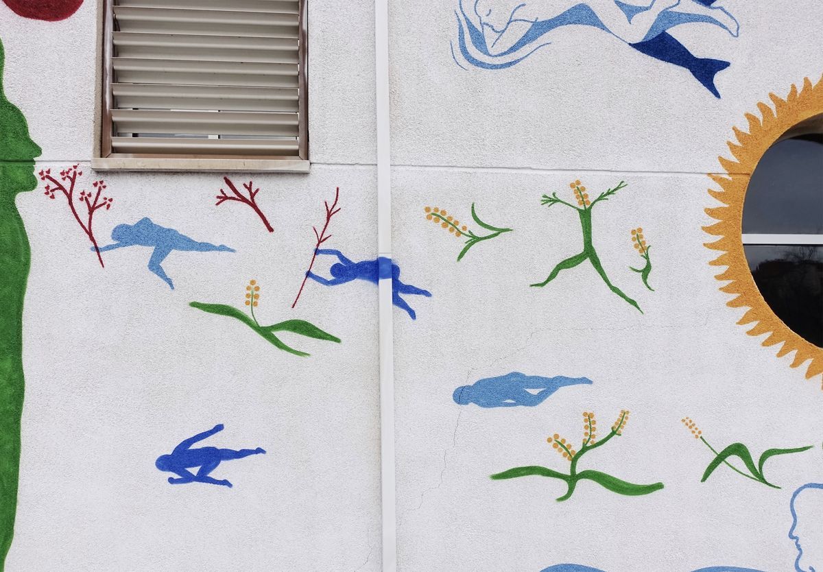 Painted detail of scattered blue running silhouette figures among red and green branch-like plants with berries, beside a white pipe and window shutter.