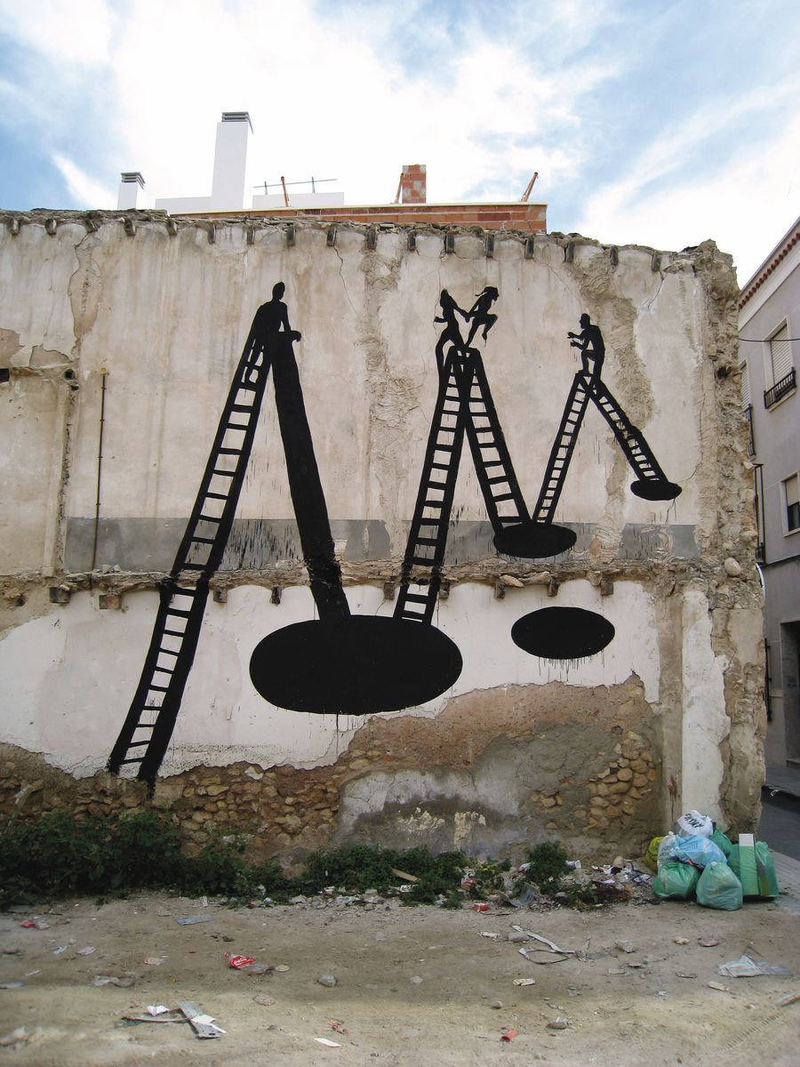 Three black silhouette stepladders with figures poised at the top, black oval shadow pools beneath each, painted on a ruined plastered wall strewn with rubble and garbage bags.
