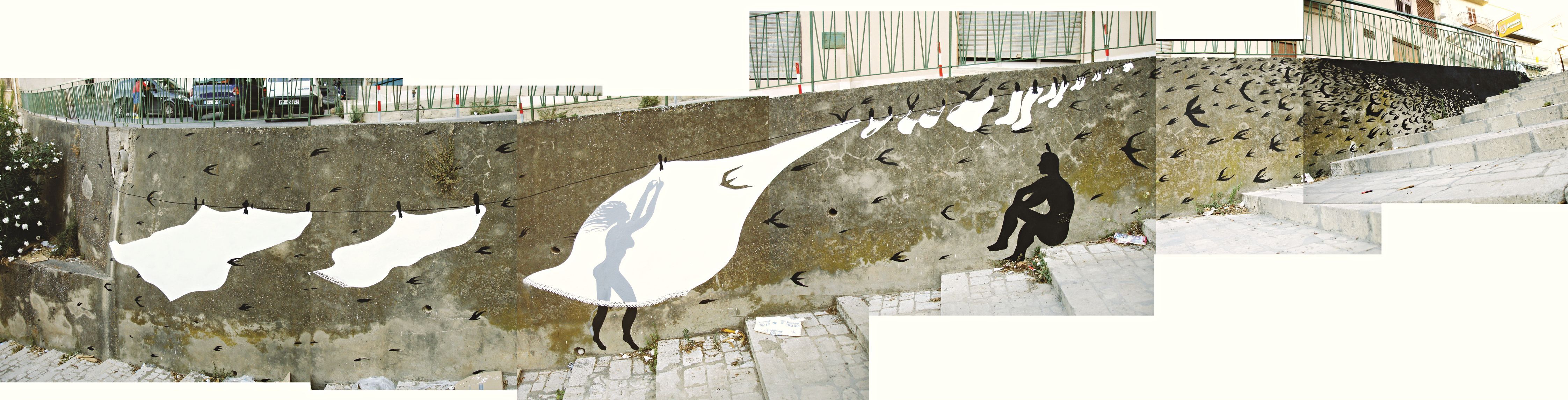 Wide panoramic view of the full clothesline mural along the retaining wall, showing a woman's silhouette hanging a garment beside several bird-shaped white sheets, a seated figure further along, swallows scattered across the concrete and steps below.