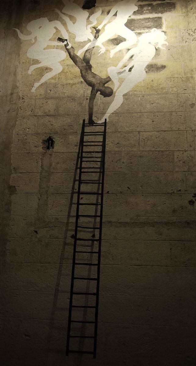 Same ladder scene lit from above by a single bulb, a small figure balancing handstand-style at the top rung amid ghostly white smoke-like silhouettes rising into the light.